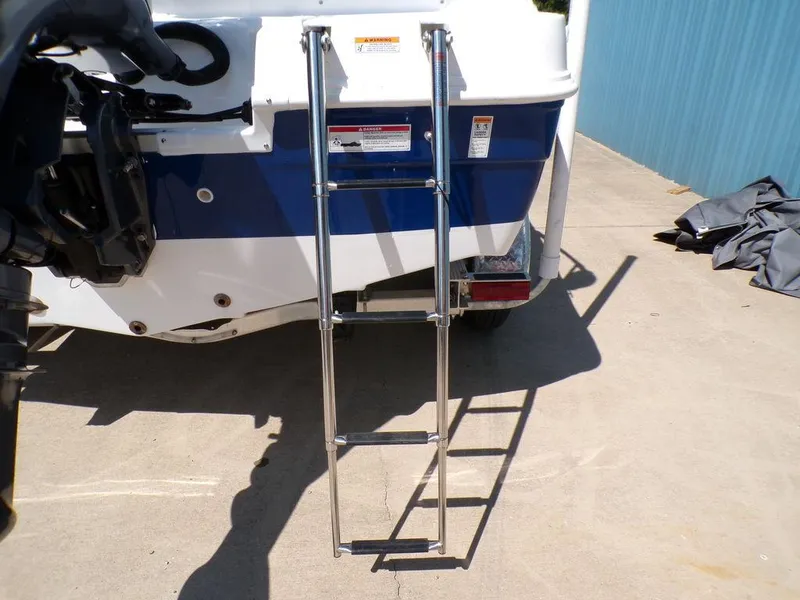 Slide: The Image of 2023 Hurricane SunDeck 187 OB boat with extended ladder. - 39