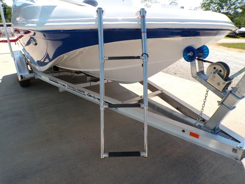 Slide: The Image of 2023 Hurricane SunDeck 187 OB boat on trailer with boarding ladder. - 40