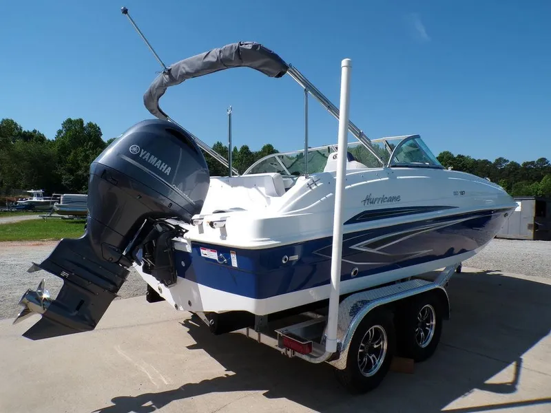 Slide: The Image of 2023 Hurricane SunDeck 187 OB boat with Yamaha outboard motor on trailer. - 5