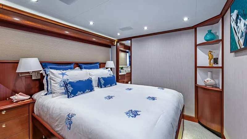 Slide: The Image of Luxurious bedroom on a 2008 Pacific Mariner 85 yacht with elegant decor and ample lighting. - 21