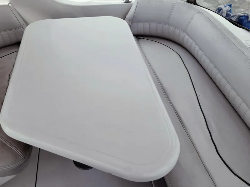 Slide: The Image of 2000 Cruisers Yachts 3375 interior with cushioned seating and table. - 17