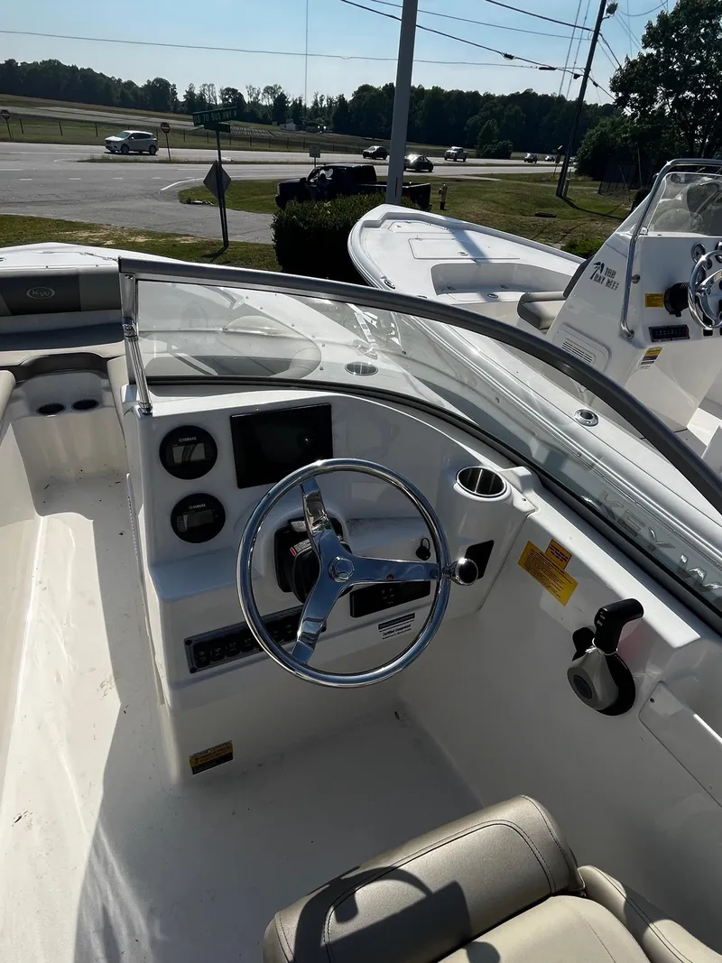 Slide: The Image of 2024 Key West 203 DFS boat cockpit with steering wheel and dashboard. - 6