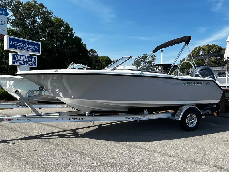 Slide: The Image of 2024 Key West 203 DFS boat on a trailer at Angler's Marine dealership. - 2