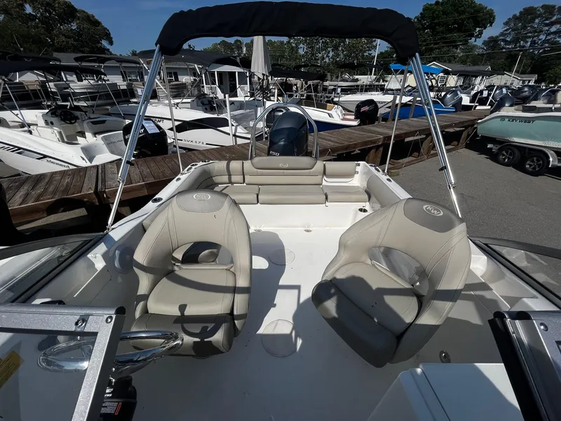 Slide: The Image of 2024 Key West 203 DFS boat interior with seating and steering console. - 5