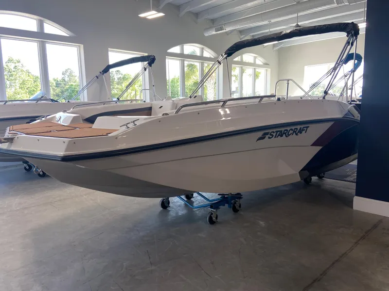 Slide: The Image of 2024 Starcraft SVX 171 boat displayed indoors. - 0