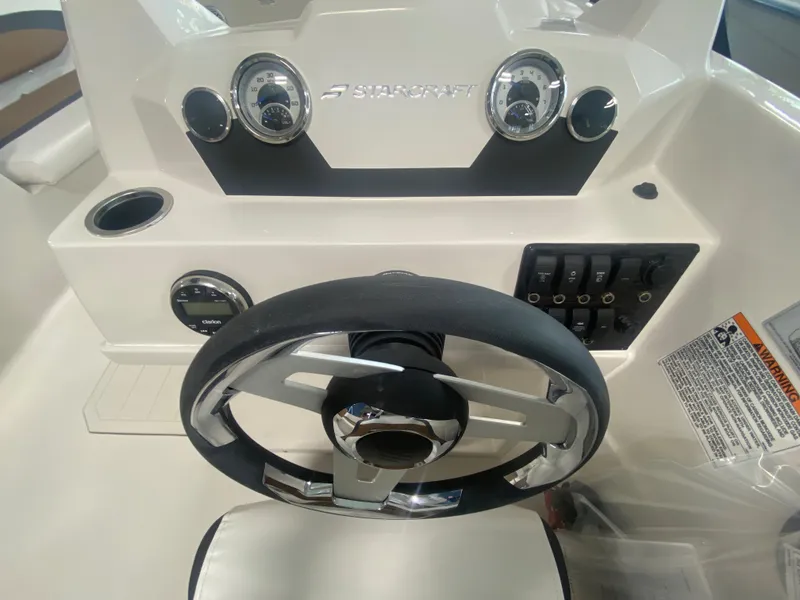 Slide: The Image of 2024 Starcraft SVX 171 boat dashboard with steering wheel and control panel. - 11