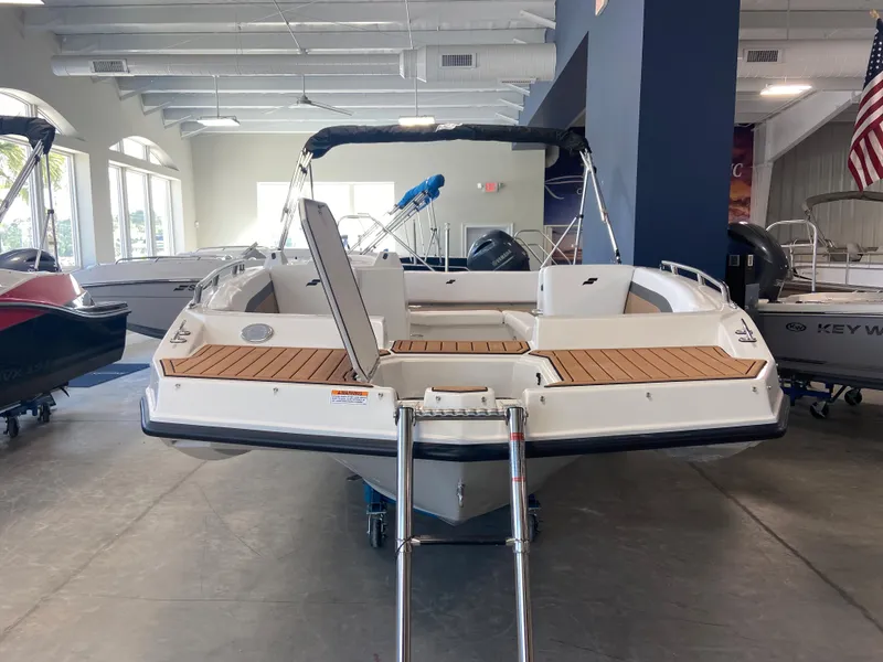 Slide: The Image of 2024 Starcraft SVX 171 boat displayed in a showroom. - 3