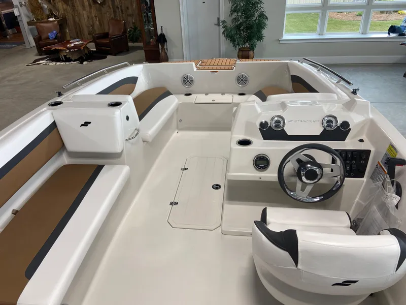 Slide: The Image of 2024 Starcraft SVX 171 boat interior with steering wheel and seating. - 4