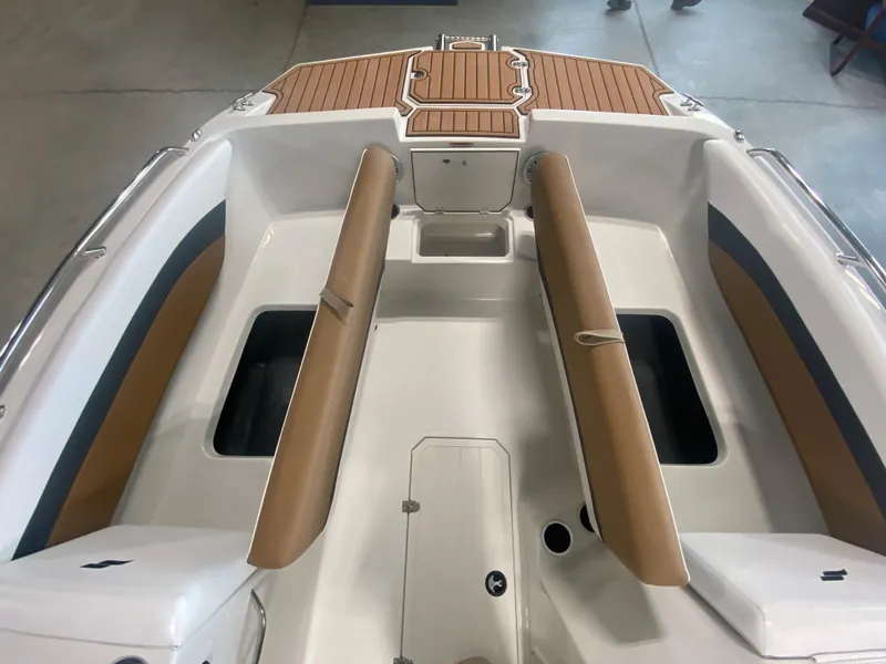 Slide: The Image of 2024 Starcraft SVX 171 boat interior with tan seating and storage compartments. - 7