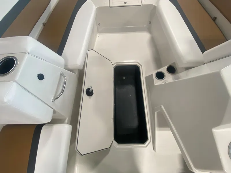 Slide: The Image of 2024 Starcraft SVX 171 boat interior with open storage compartment. - 8