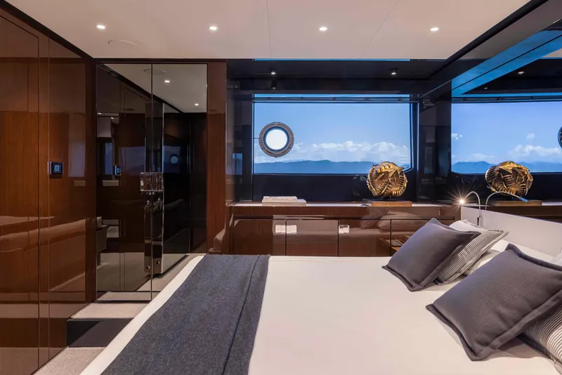 Slide: The Image of Luxurious bedroom interior of 2025 Riva 68' DIABLE yacht with ocean view. - 18