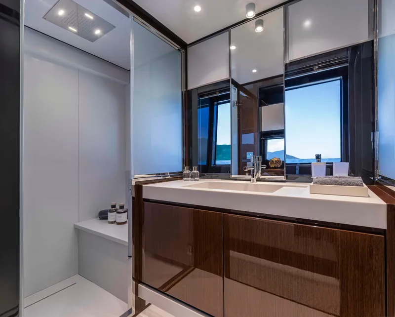 Slide: The Image of Luxurious bathroom interior of 2025 Riva 68' DIABLE yacht with modern fixtures and ocean view. - 20