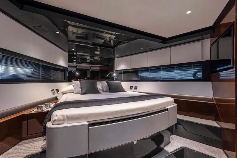 Slide: The Image of Luxurious bedroom interior of 2025 Riva 68' DIABLE yacht with modern design and elegant furnishings. - 21