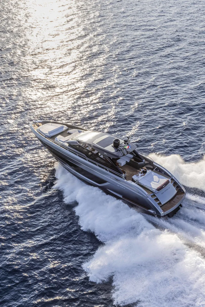 Slide: The Image of 2025 Riva 68' DIABLE luxury yacht cruising on open water. - 7