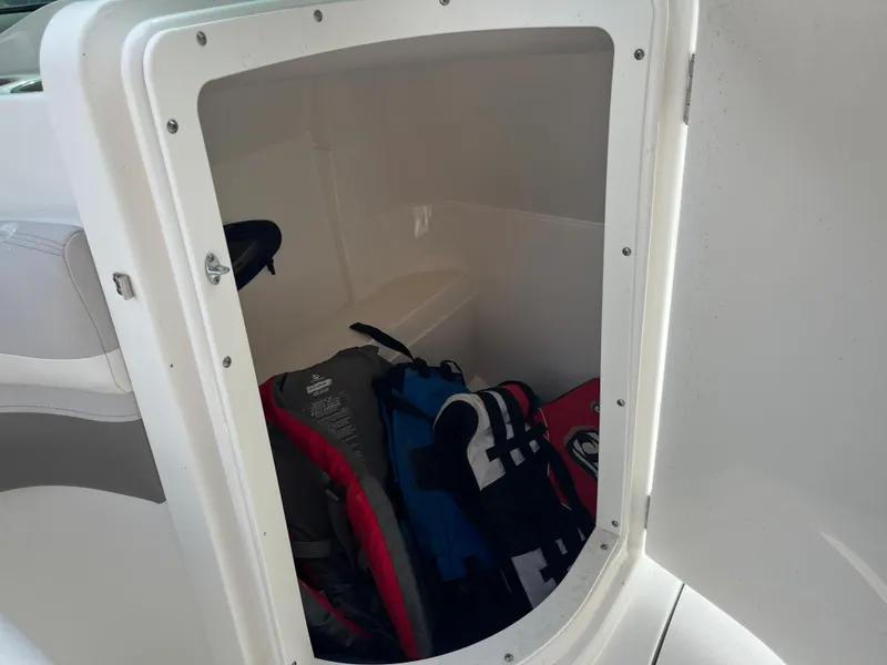 Slide: The Image of Storage compartment of a 2017 Hurricane SD 2400 I/O boat with life jackets. - 12
