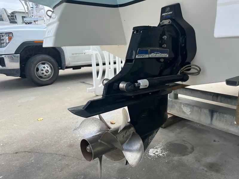 Slide: The Image of 2017 Hurricane SD 2400 I/O boat stern drive and propeller in a parking area. - 19