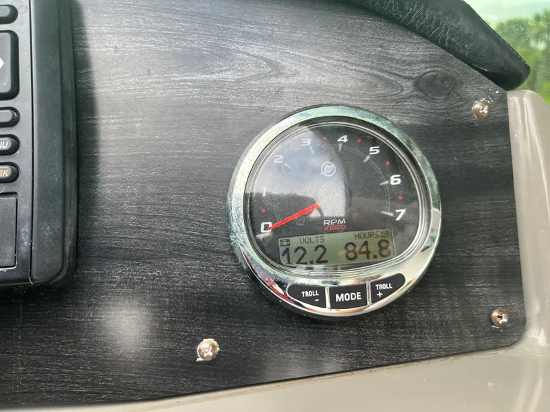 Slide: The Image of 2017 Hurricane SD 2400 I/O boat dashboard with RPM gauge and digital display. - 2