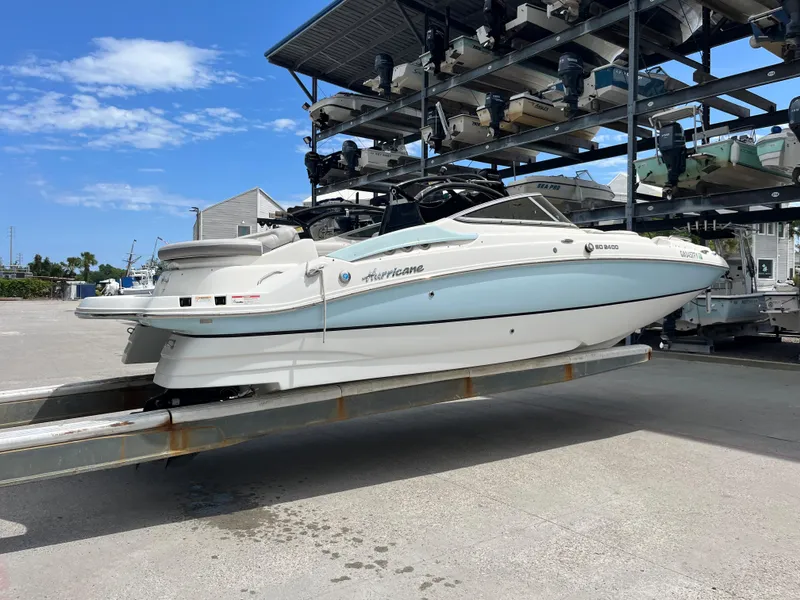 Slide: The Image of 2017 Hurricane SD 2400 I/O boat on a lift at a marina. - 26