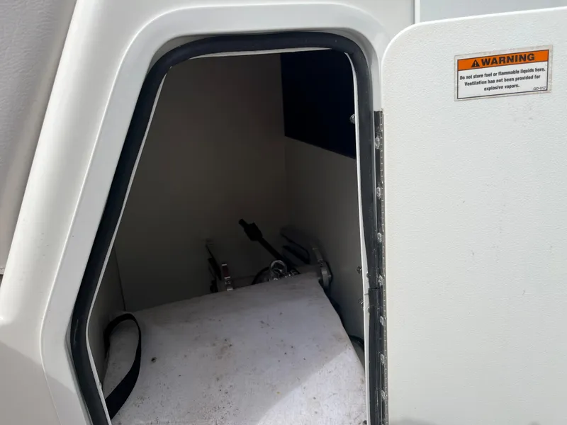 Slide: The Image of 2017 Hurricane SD 2400 I/O storage compartment with warning label. - 27