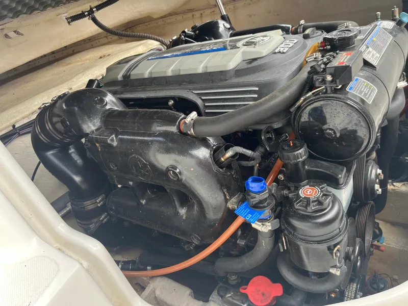 Slide: The Image of 2017 Hurricane SD 2400 I/O boat engine compartment with visible engine components. - 4