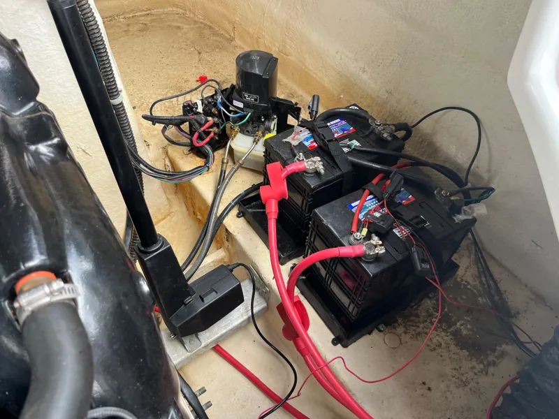 Slide: The Image of 2017 Hurricane SD 2400 I/O boat battery compartment with wiring and components. - 6