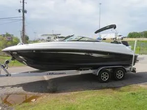 Slide: The Image of 2014 Sea Ray 240SD boat on a trailer in a parking lot. - 10