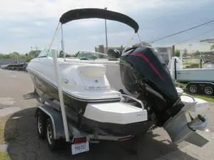 Slide: The Image of 2014 Sea Ray 240SD boat on a trailer, rear view with outboard motor. - 12