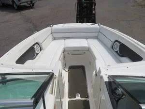 Slide: The Image of 2014 Sea Ray 240SD boat interior with white seating and speakers. - 13