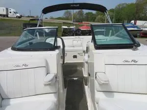 Slide: The Image of 2014 Sea Ray 240SD boat with open bow seating and black bimini top. - 16