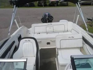 Slide: The Image of 2014 Sea Ray 240SD boat interior with white seating and black accents. - 17