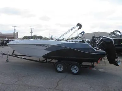 Slide: The Image of 2014 Sea Ray 240SD boat on a trailer in a parking lot. - 18