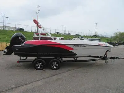 Slide: The Image of 2014 Sea Ray 240SD boat on a trailer in a parking lot. - 19