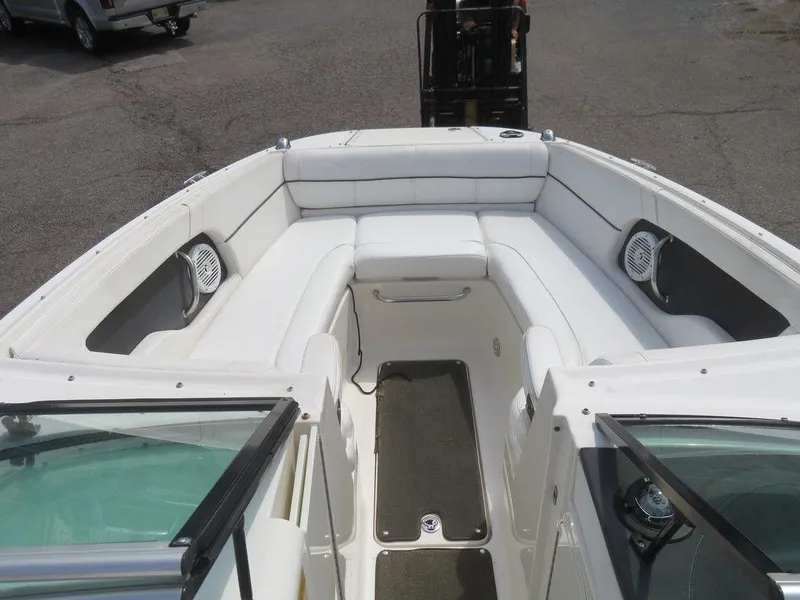 Slide: The Image of 2014 Sea Ray 240SD boat interior with white seating and speakers. - 5