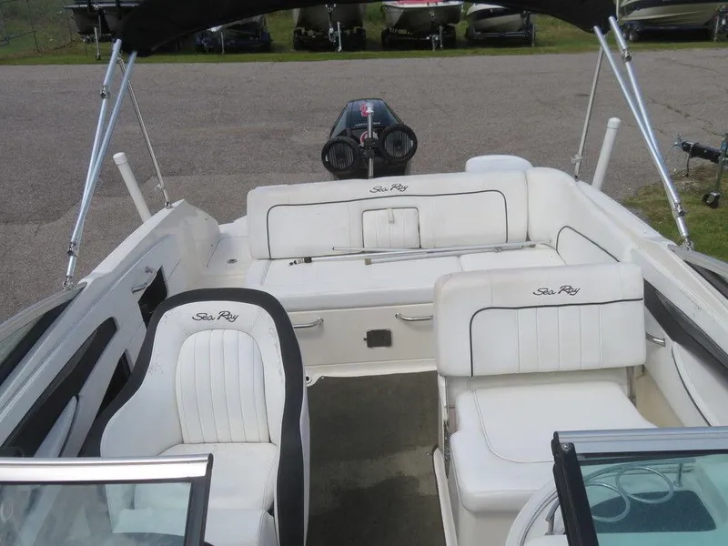 Slide: The Image of 2014 Sea Ray 240SD boat interior with white seating and black accents. - 7