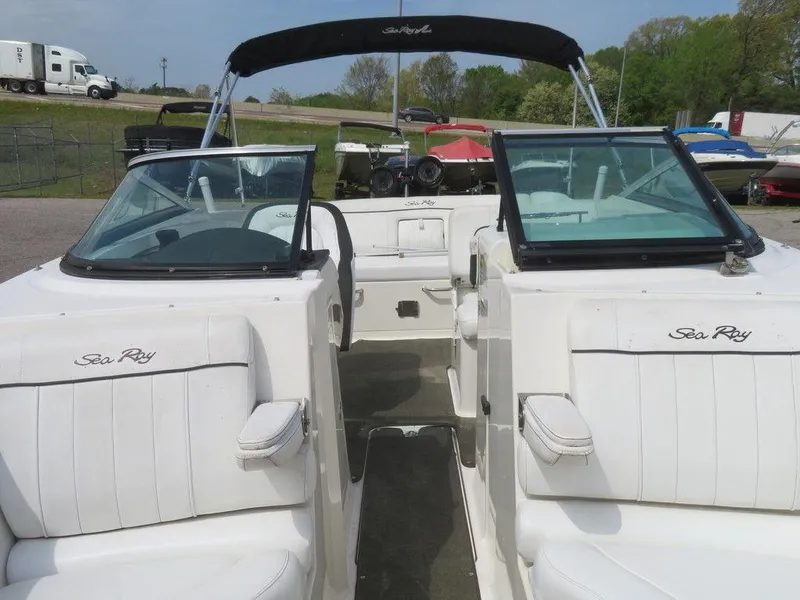Slide: The Image of 2014 Sea Ray 240SD boat with white interior and black canopy. - 9