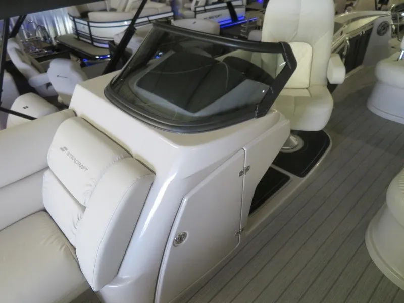 Slide: The Image of 2023 Starcraft SX 25 Q boat interior with helm and seating. - 20