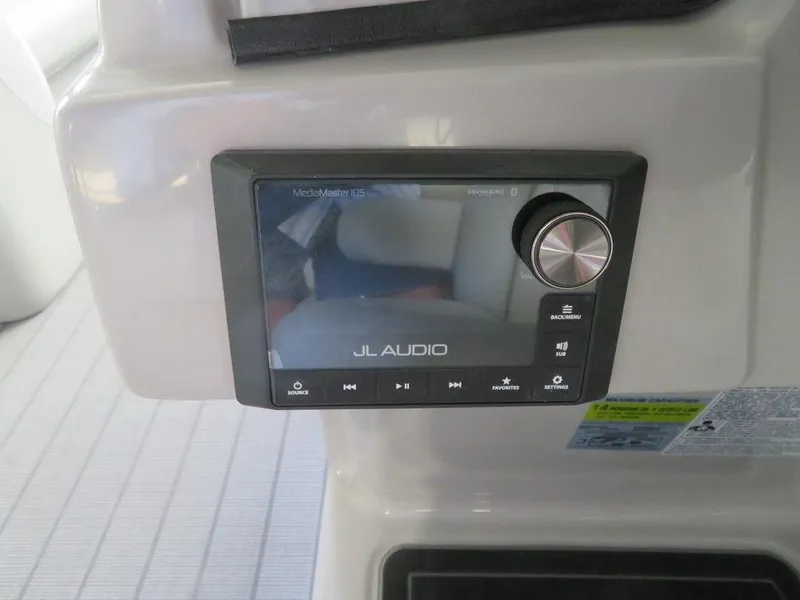 Slide: The Image of 2023 Starcraft SX 25 Q JL Audio system control panel. - 22