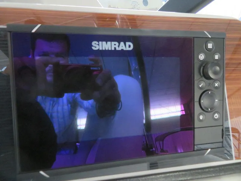 Slide: The Image of Simrad navigation system on 2023 Starcraft SX 25 Q boat. - 26