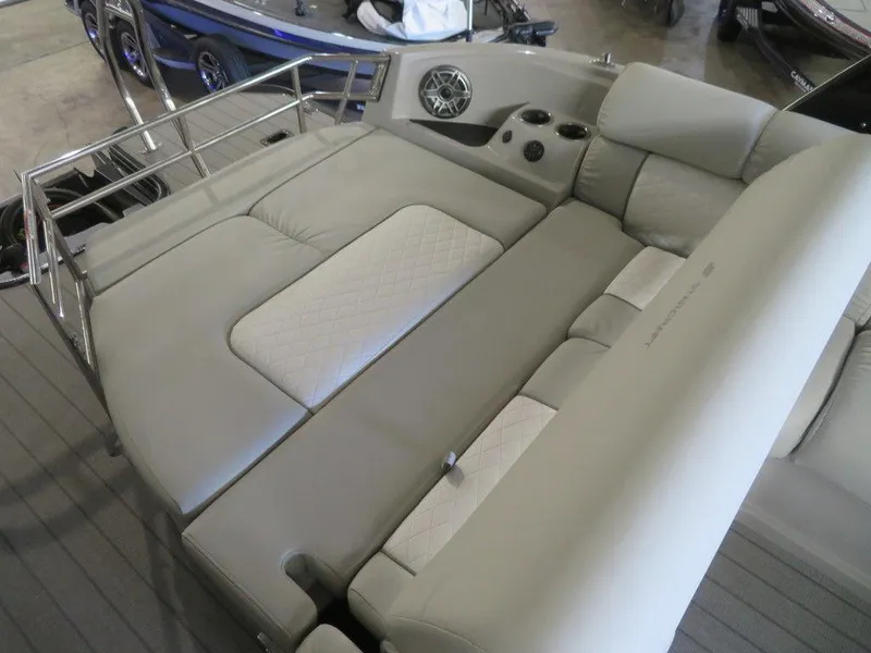 Slide: The Image of 2023 Starcraft SX 25 Q boat interior with luxurious seating and cup holders. - 33