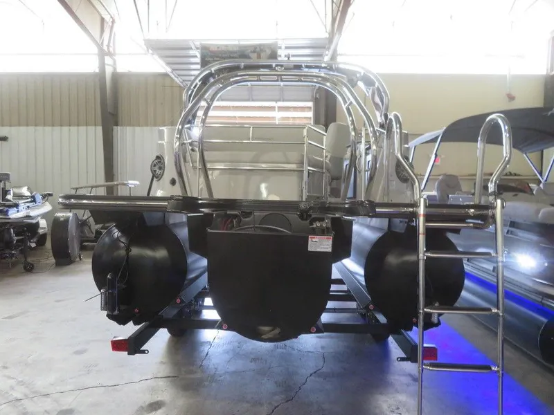 Slide: The Image of 2023 Starcraft SX 25 Q pontoon boat in a warehouse. - 9