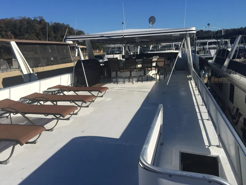 Slide: The Image of 2002 Stardust Cruisers Houseboat with spacious upper deck and lounge chairs. - 25