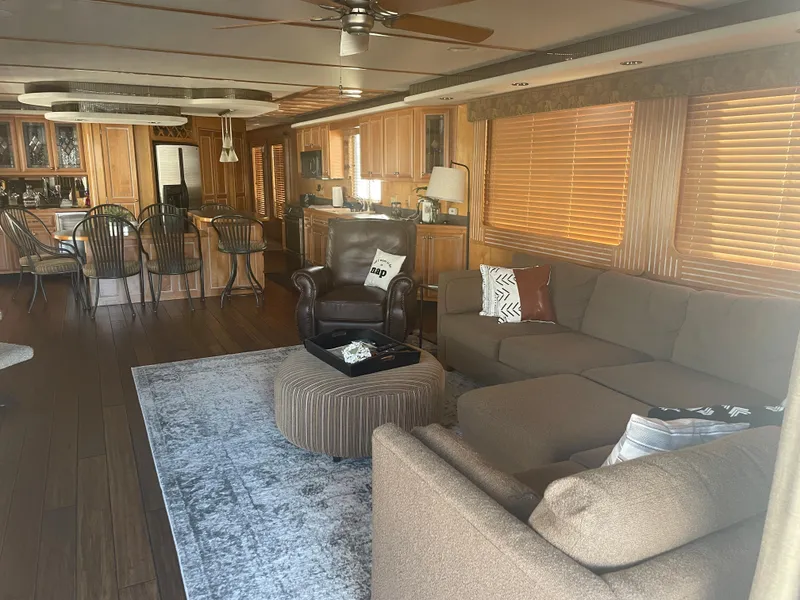 Slide: The Image of Luxurious 2002 Stardust Cruisers houseboat interior with modern kitchen and cozy living area. - 5