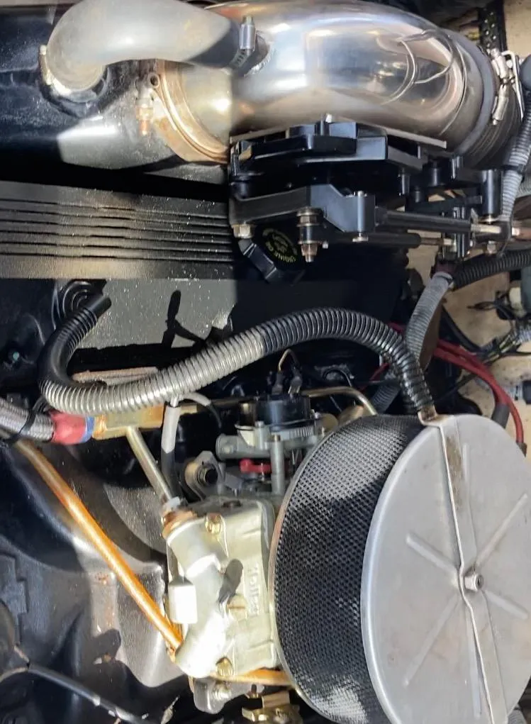 Slide: The Image of Engine of a 1997 Donzi 22ZX boat, showcasing mechanical components and wiring. - 10