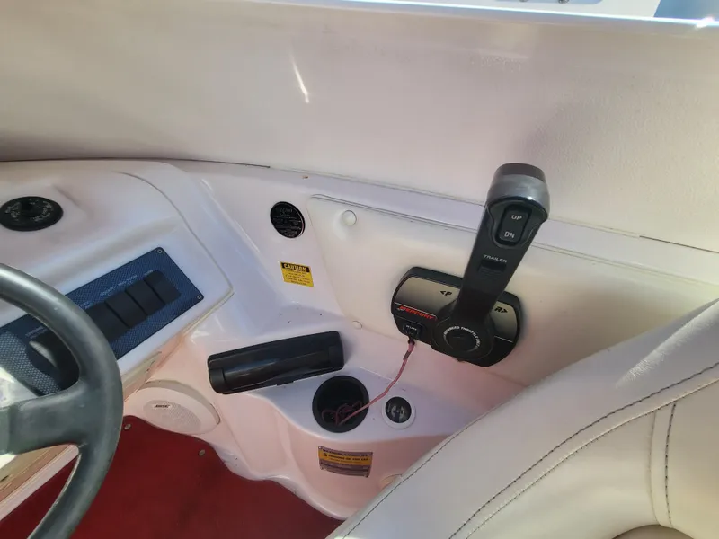 Slide: The Image of 1997 Donzi 22ZX boat interior with steering wheel and control panel. - 16