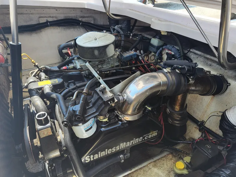 Slide: The Image of Engine compartment of a 1997 Donzi 22ZX boat, featuring a Stainless Marine system. - 2