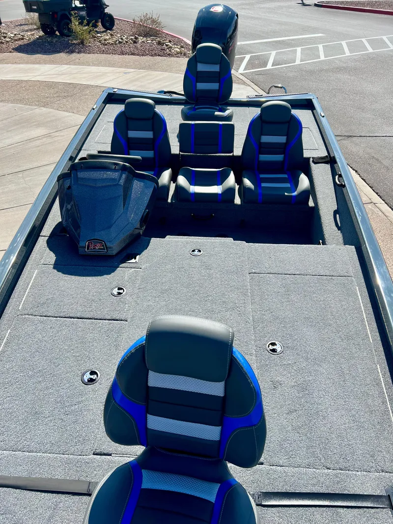 Slide: The Image of 2023 Ranger RT198P fishing boat with blue and gray seating. - 2