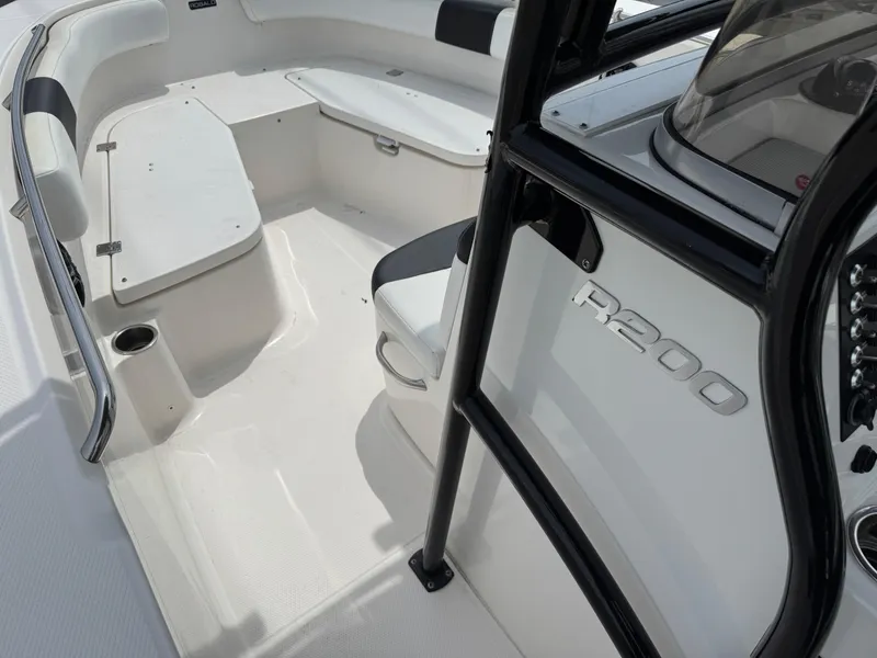 Slide: The Image of 2018 Robalo R200 Center Console boat interior with seating and console details. - 12