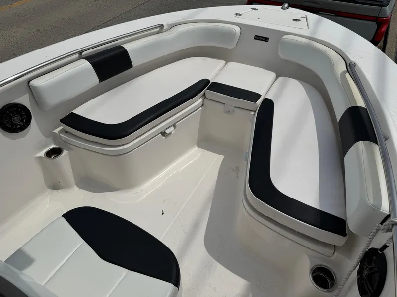 Slide: The Image of 2018 Robalo R200 Center Console boat interior with cushioned seating and storage compartments. - 14