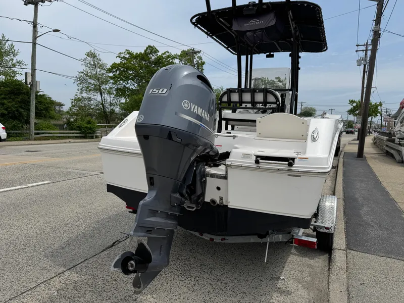 Slide: The Image of 2018 Robalo R200 Center Console boat with Yamaha 150 outboard motor on a trailer. - 19