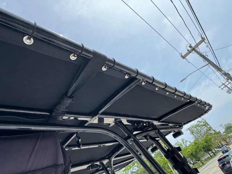 Slide: The Image of 2018 Robalo R200 Center Console boat canopy, viewed from below, against a clear sky. - 5